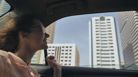 Happy Girl driving a car in Dubai.の写真素材