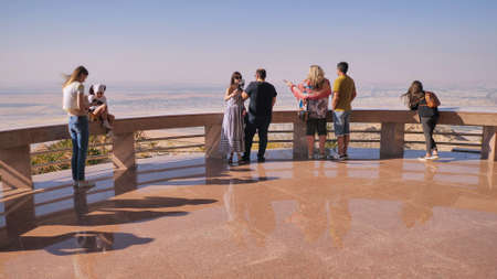 Al Ain, UAE - December 15, 2019: Top with tourists near the city of Al Ain in the United Arab Emirates.のeditorial素材