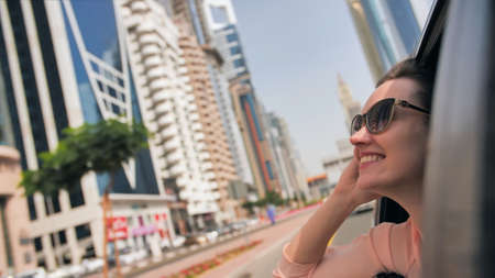 Happy Girl driving a car in Dubai. UAE.の写真素材