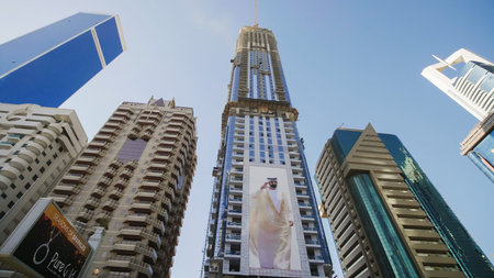 Dubai, UAE - December 14, 2019: Tall and modern skyscrapers of Dubai on a sunny day.
