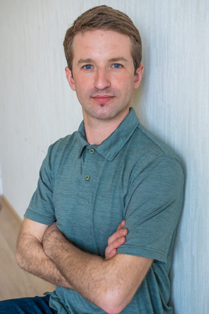 Portrait of a young european man at home.