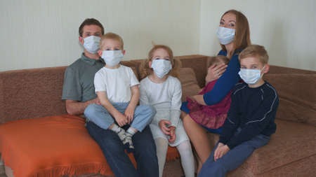 Quarantine end concept. A large family takes off masks at home.の写真素材