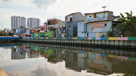 Slum area on the riverbank in Jakarta. Indonesia.の写真素材