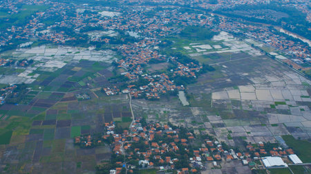 The view from the airplane window on the fields and villages of Bali. Indonesia.