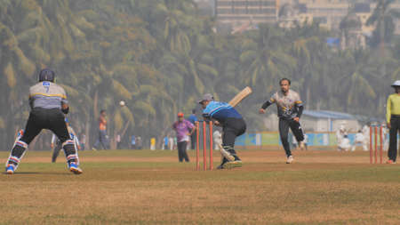 People playing cricket in the central park at Mumbai, Slow Motion view.のeditorial素材