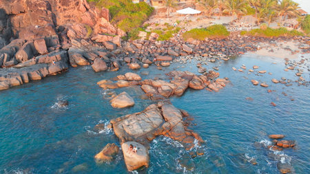 Rocky beach near Palolem beach at sunset. Goa State. Indiaの写真素材