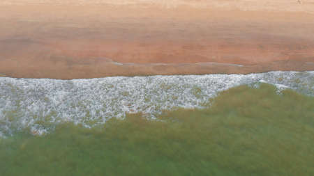 Aerial drone view of deserted Arambol beach on Goa with waves. Indiaの写真素材
