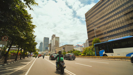 Jakarta, Indonesia - January 15, 2019: Drive through the streets of Jakarta with skyscrapers.