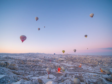 Cappadocia, Turkey - January 6, 2020: Colorful balloons over volcanic rocks in Cappadocia. Turkey.のeditorial素材