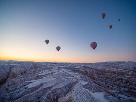 Goreme, Turkey - January 11, 2020: Colorful balloons at sunrise in Cappadocia. Turkey.のeditorial素材