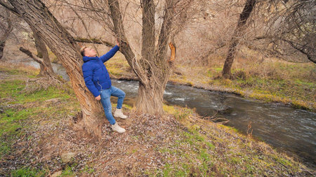 A tourist strolling among the rocks in the Ihlara Valley in Cappadocia, Turkey.の写真素材