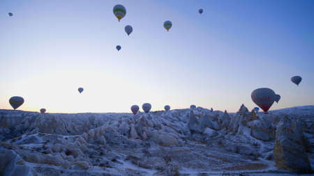 Cappadocia, Turkey - January 6, 2020: Color balloons in the sunrise sky. Cappadocia, Turkey.のeditorial素材