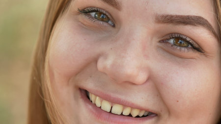 Close up of young smiling girl face.