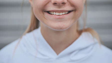 Smile of a bright teenage girl close up.の写真素材