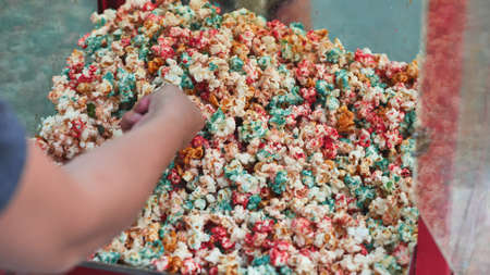 colored popcorn on white backgroundの写真素材