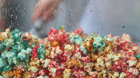 colored popcorn on white backgroundの写真素材