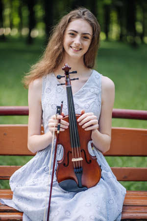Portrait of a young girl with her violin.の写真素材