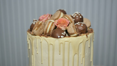 White cheese glaze cake with cookies on top.