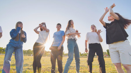 A group of funny friends dancing in the street.の写真素材
