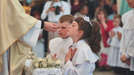 Lida, Belarus - May 31, 2022: Children going to the first holy communion.のeditorial素材
