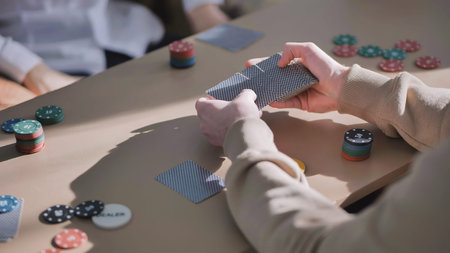 Young guys playing poker at a table.