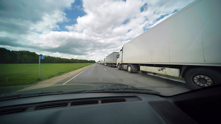 A jam of vans on the roads of Europe. View from the car window.