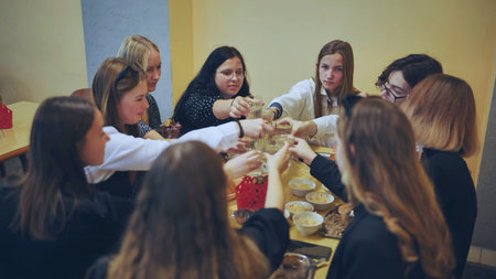 Senior girls having breakfast in the school canteen.