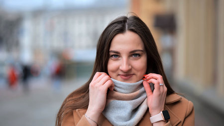 Portrait of a Slavic girl in the city in the cold season.