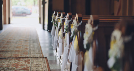 Empty church aisle decorated with flowers for wedding ceremonyの写真素材