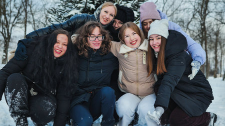 Fun friends posing on a winter day in the woods.の写真素材