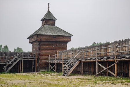 Ancient russian fortress with high wooden tower and palisade, evoking historical battles and medieval lifeの写真素材