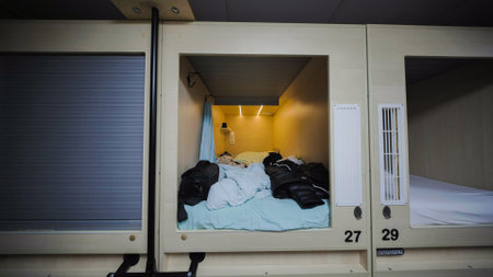 Capsule hotel room offering privacy and comfort for travelersの写真素材