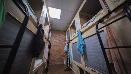 Compact hostel sleeping pods providing privacy and comfort for budget travelersの写真素材