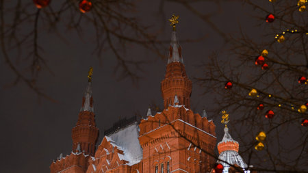 State Historical Museum in Moscow celebrating New Year with christmas decorations and snow at nightの写真素材