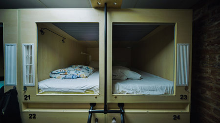 Capsule hotel beds providing comfortable and affordable accommodationの写真素材