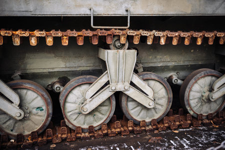 Rusty caterpillar track and wheels of a military tankの写真素材