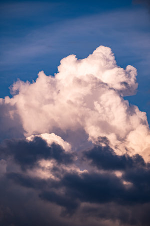 Clouds building in blue sky, showing atmospheric conditions and changing weather