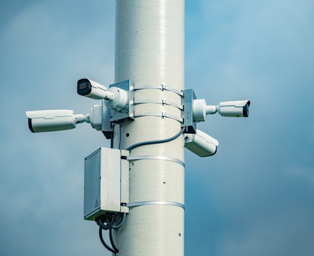 Multiple cctv cameras on a pole monitoring public spaces for security and safetyの写真素材