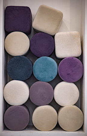 Colorful velvet poufs arranged in geometry, soft furniture for comfortable interiorの写真素材