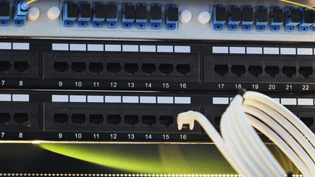Network cables connecting to patch panel in data center for internet communication