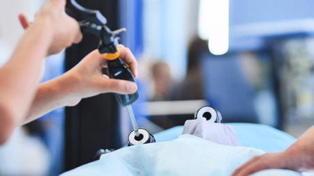 Surgeon performing advanced laparoscopic surgery using medical training simulatorの写真素材