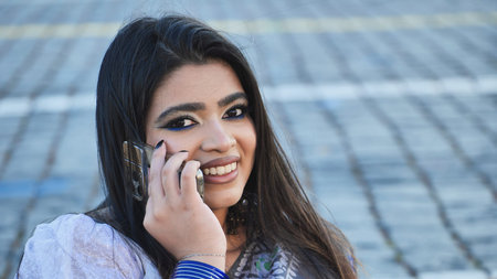 Young Indian woman talking on phone in Moscowの写真素材