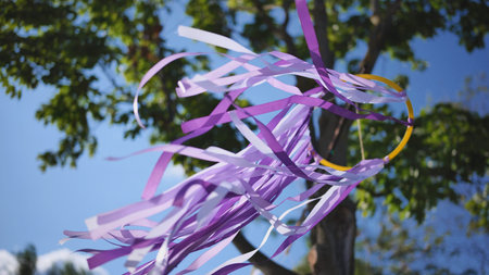 Purple ribbons blowing from a decorative hoop in the wind at India Day in Moscow festival