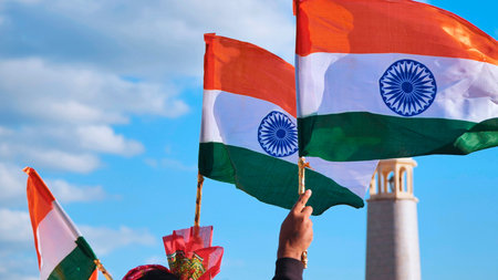 Waving Indian national flags celebrating India Day in Moscow, cultural festival demonstrating unity