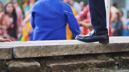 Persons foot and shoe during Ganesh Chaturthi festival celebration in India