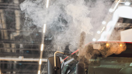 Truck emitting exhaust smoke causing air pollution and environmental impact
