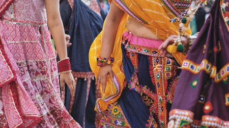 Women dancing in traditional clothes celebrating Ganesh Chaturthi festival in India