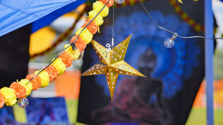 Golden star decoration and marigold garlands celebrating Indian culture at a festival