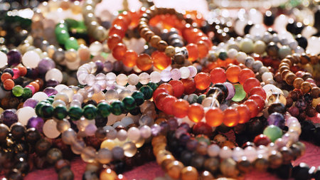 Colorful gemstone bracelets displaying India Day market merchandise in Moscow