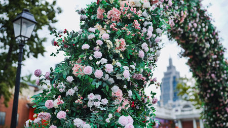 Floral arch decorating a city park with Empire State Building in background
